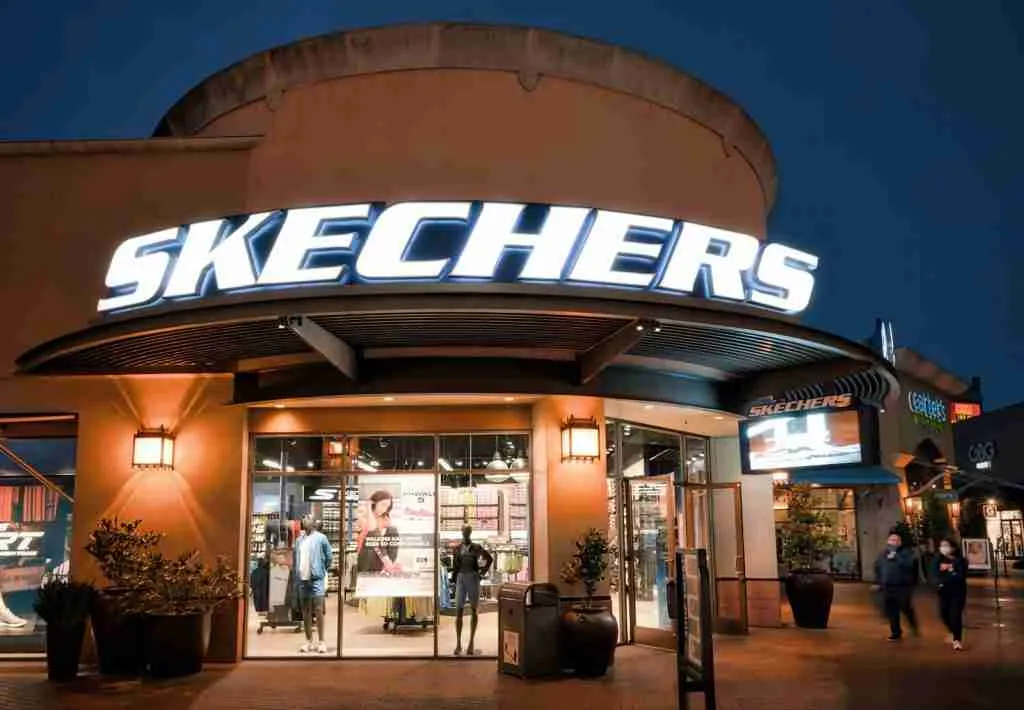 24 Interesting Facts About Skechers: Exploring the Shoemaking Wonders 2 people walking around Skecher outlet during daytime