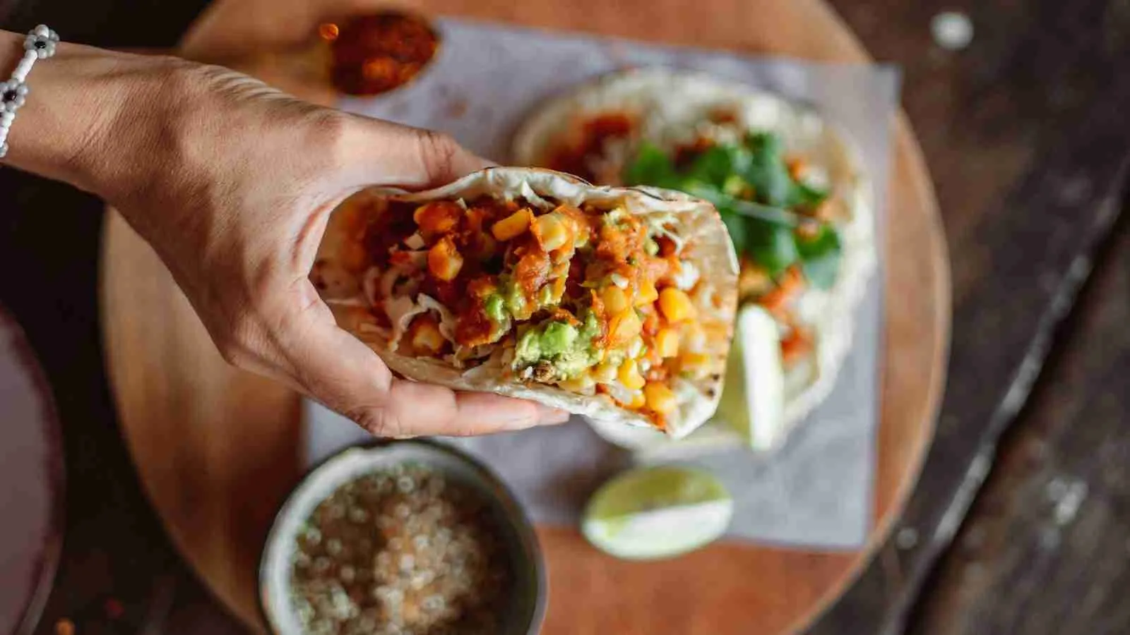 A Person Holding a Taco