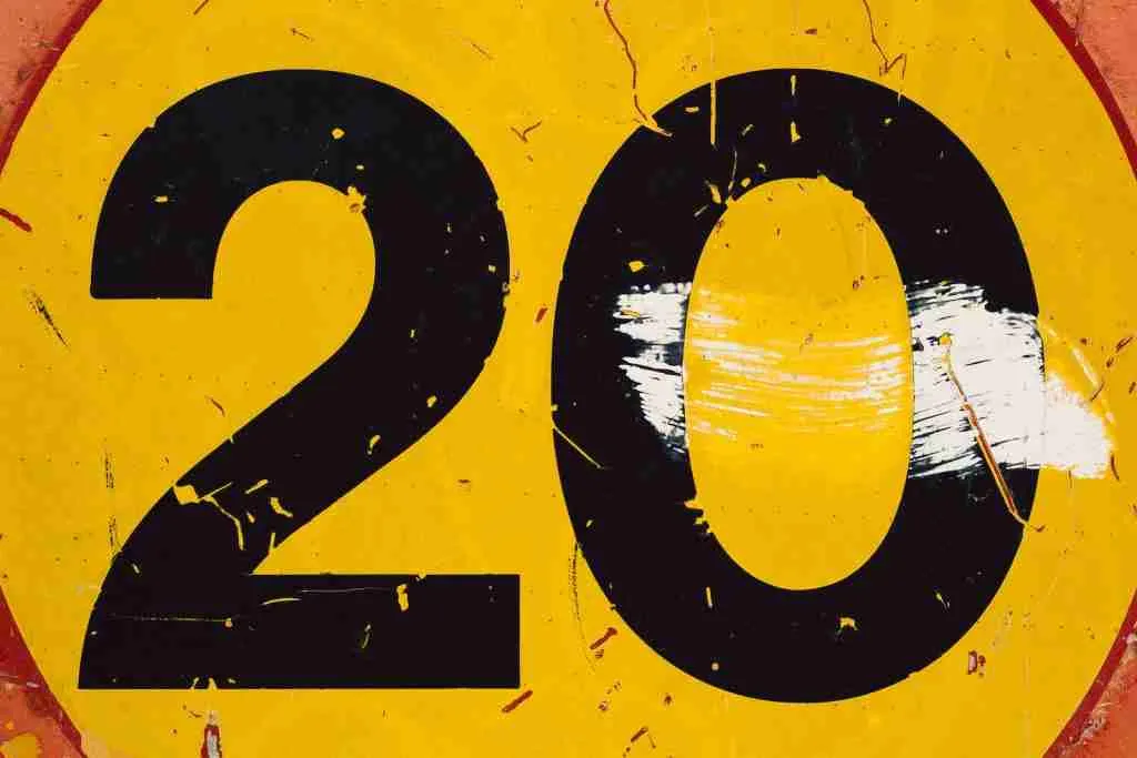 round yellow and black 20 text signboard