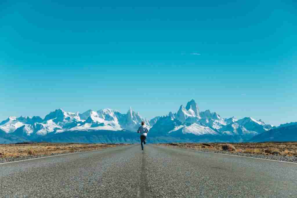 person running on road at daytime
