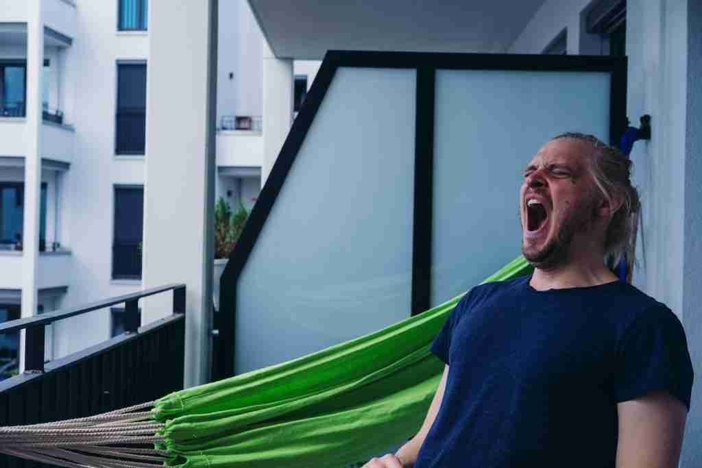 21 Facts About Yawning You Didn’t Know 3 man in blue Yawning .