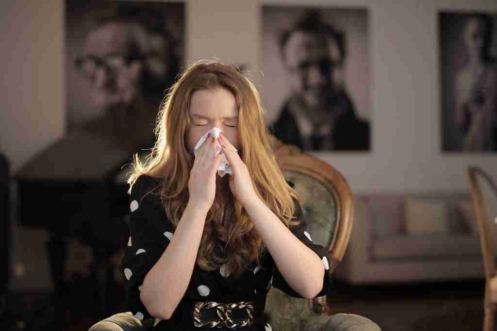 70 Creepy Facts That Will Keep You Up at Night 1 Sick Woman Wiping Her Nose with Tissue