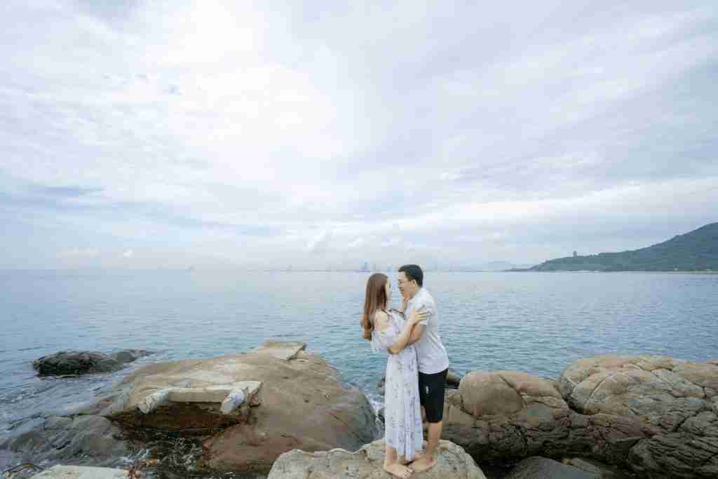 25 Fun Facts About Brazil: Surprises You Never Expected 3 Side view full body of barefoot couple in summer clothes cuddling on big boulders on beach near sea in summer day under cloudy sky while looking at each other
