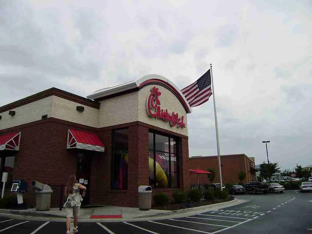 26 Fun Facts About Chick-fil-A: Unveiling Their Secret Menu 5 A brown building and flag