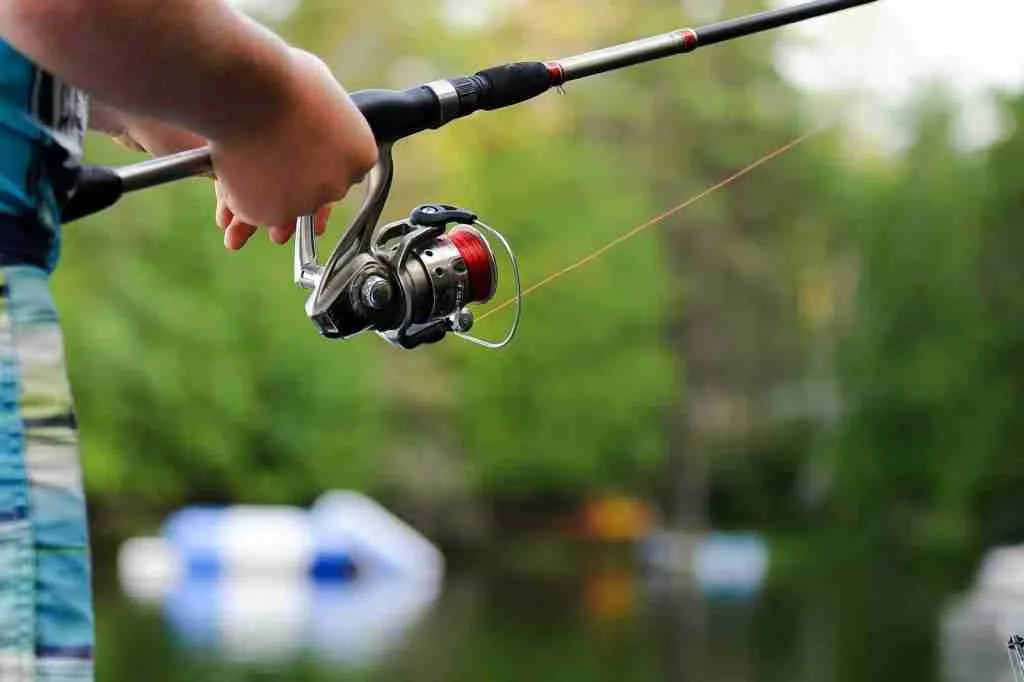 23 Fun Facts About Fishing: The $1 Million Lure Revealed 2 person holding fishing reel