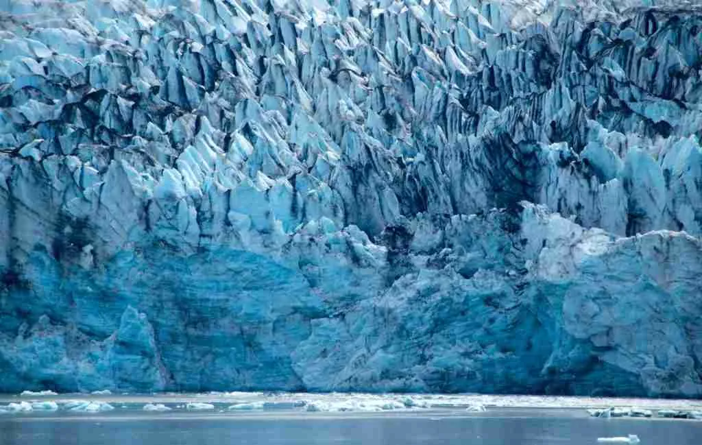gray rock formation near body of water during daytime
