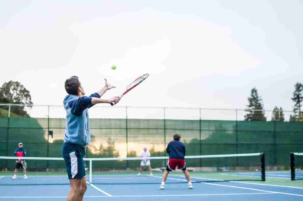25 Fun Facts About Tennis You Didn't Know 4 four men playing double tennis during daytime
