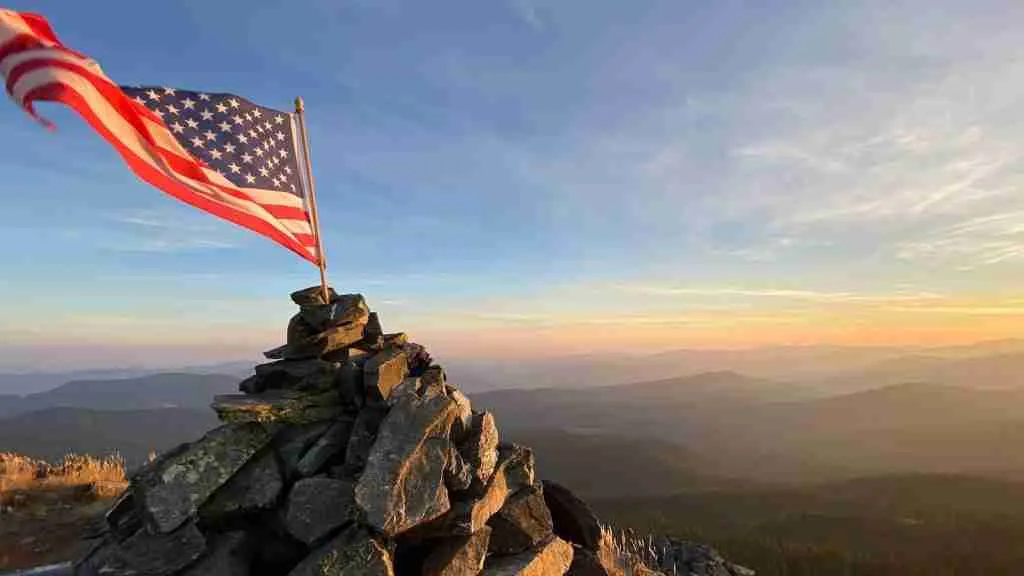 A US flag on a rock formation during daytime, capturing the essence of fun facts about the USA flag.