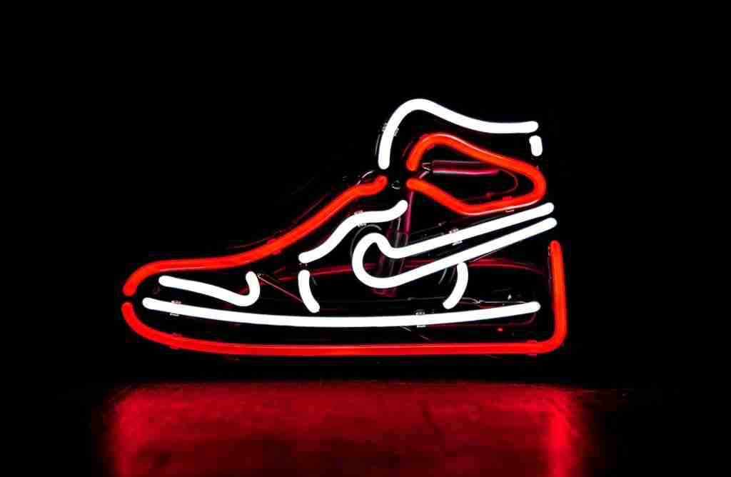 24 Interesting Facts About Nike (Just Know It) 2 red and white Nike basketball shoe neon signage