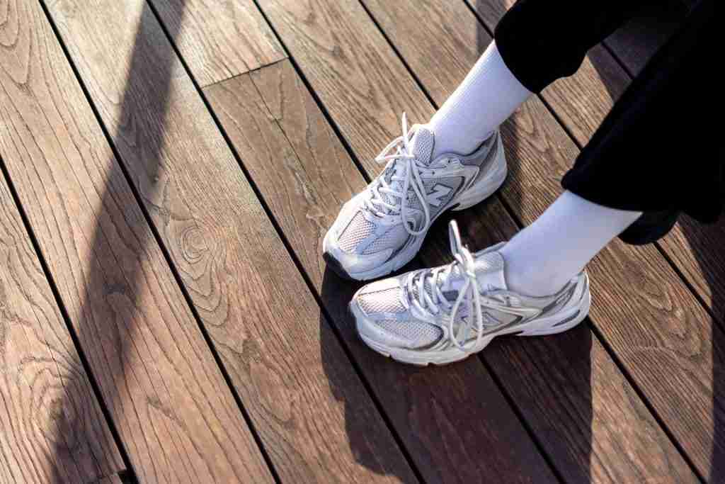 25 Interesting Facts About New Balance | The Dad Shoes 3 a pair of white shoes sitting on top of a wooden floor