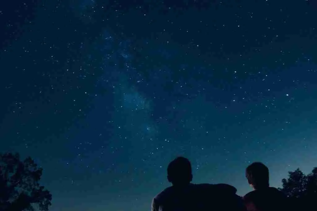 silhouette photo of two person watching stars