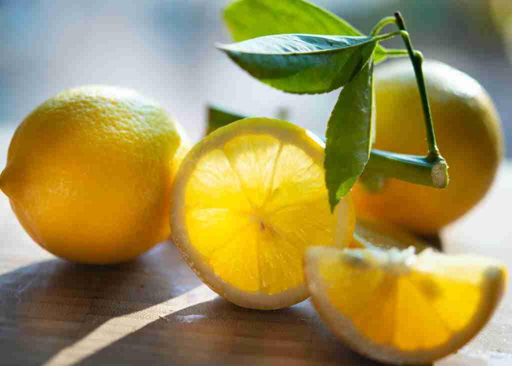 25 Fun Facts About Food | Bite into Surprise 2 yellow lemon fruit on brown wooden table : Fun Facts About Food