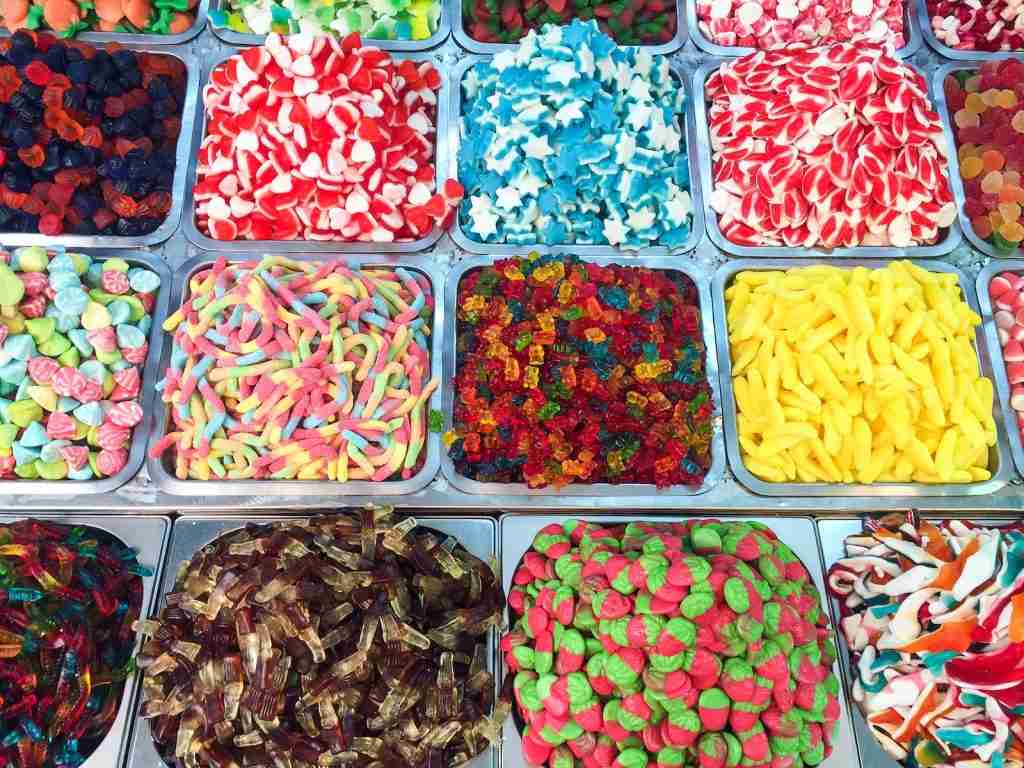 26 Fun Facts About Halloween | Behind the Mask 2 assorted candies in plastic containers : Fun Facts About Halloween