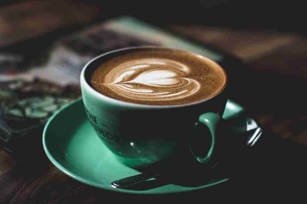 33 Fun Facts About Stomach | Digestive Powerhouse 1 green ceramic teacup filled with latte