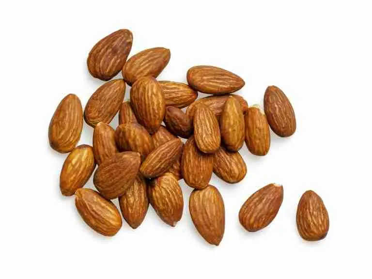brown almond nuts on white background