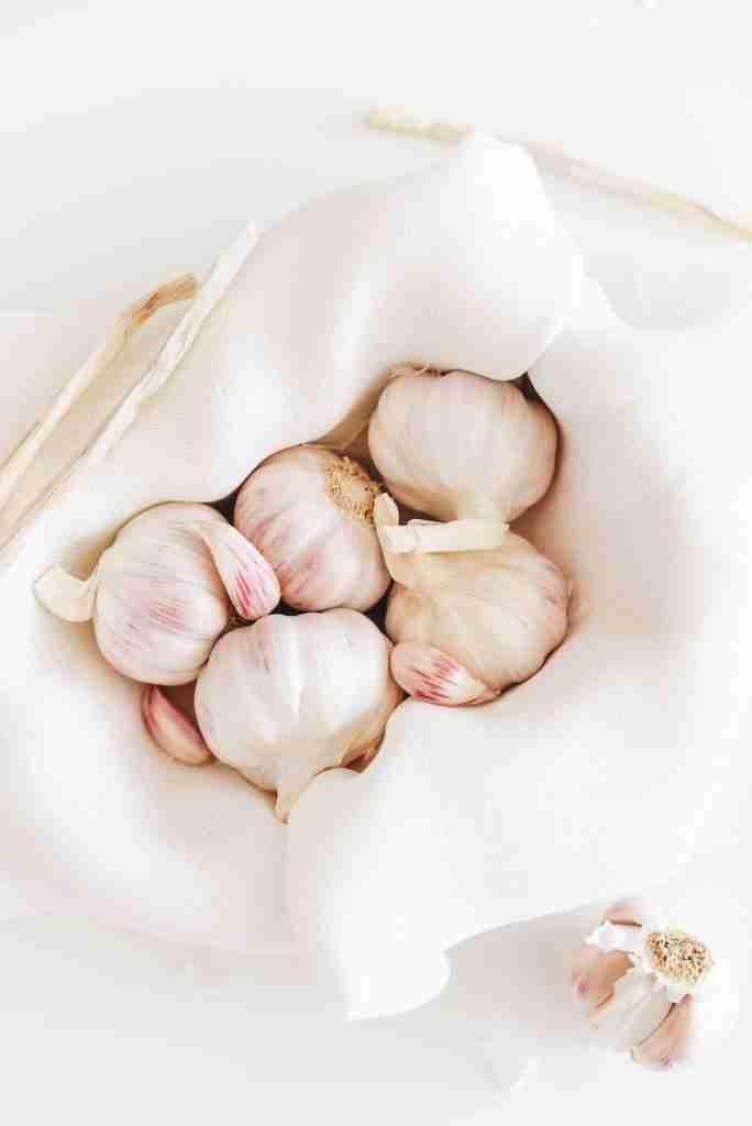 25 Fun Facts About Food | Bite into Surprise 4 five garlic on white textile