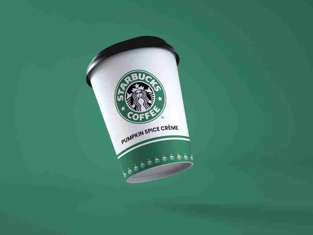 23 Interesting Facts About Starbucks You Never Knew 4 a starbucks coffee cup flying through the air