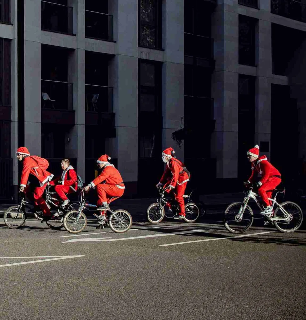 25 Fun Facts About Google | The Playful Side of Search 4 group of people wearing Santa costume riding bikes