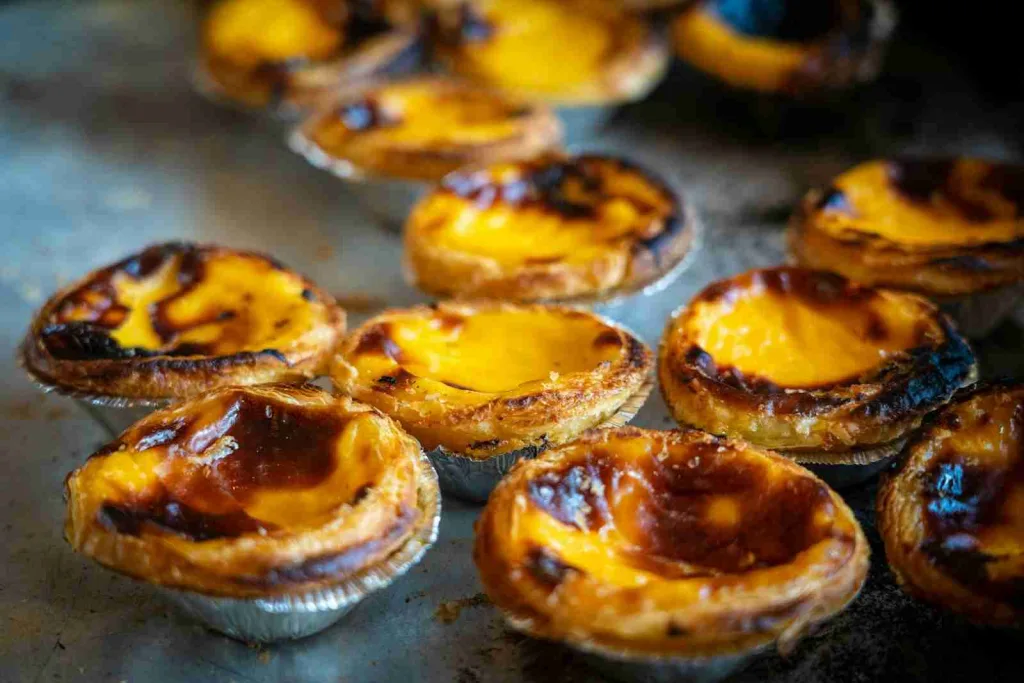 24 Fun Facts About Portugal That Will Amaze You 3 brown cupcakes on silver tray
