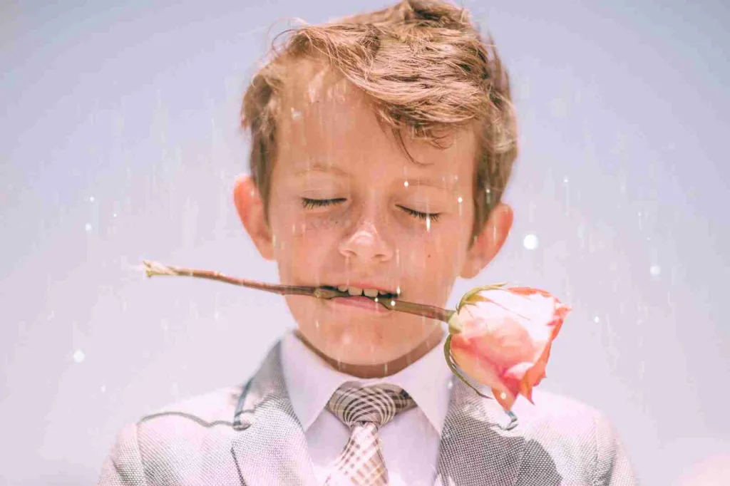 21 Fun Facts About Eyes | Test Your Eye-Q 3 boy biting stem of pink rose