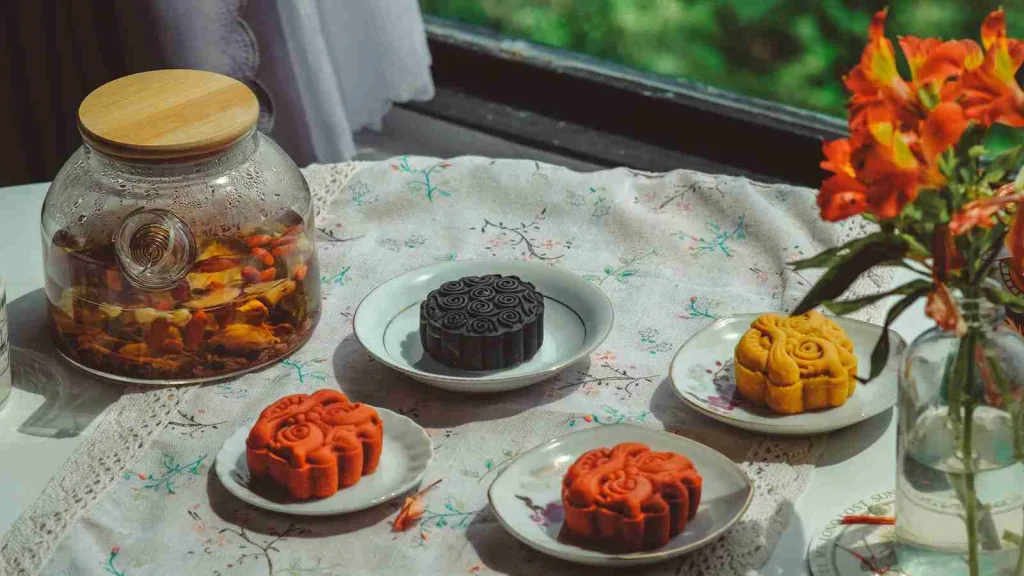 25 Fun Facts About Holidays | Surprising Customs Revealed 4 a table topped with plates of food next to a vase filled with flowers