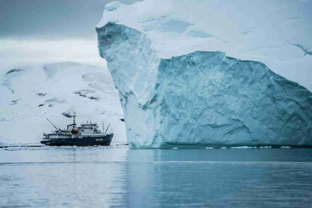 24 Fun Facts About the Arctic | Beyond Ice and Snow 1 boat beside iceberg