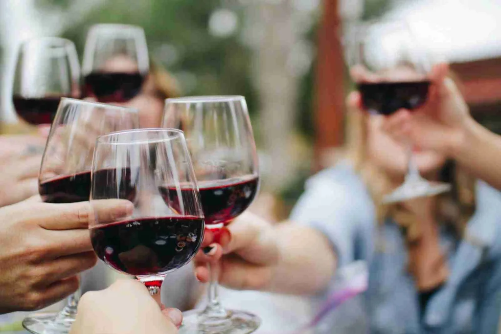 25 Fun Facts About The Color Red/ Red Alert 2 people tossing their clear wine glasses