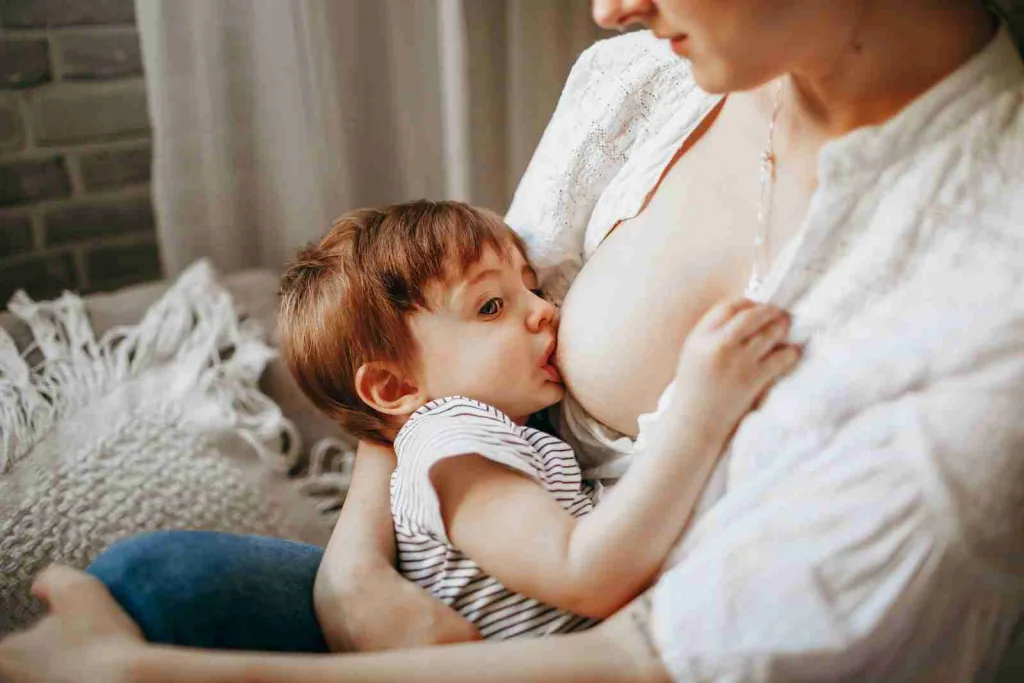 22 Fun Facts About Newborns | Eye-Opening Details 1 woman in white tank top carrying baby in black and white stripe onesie : Fun Facts About Newborns