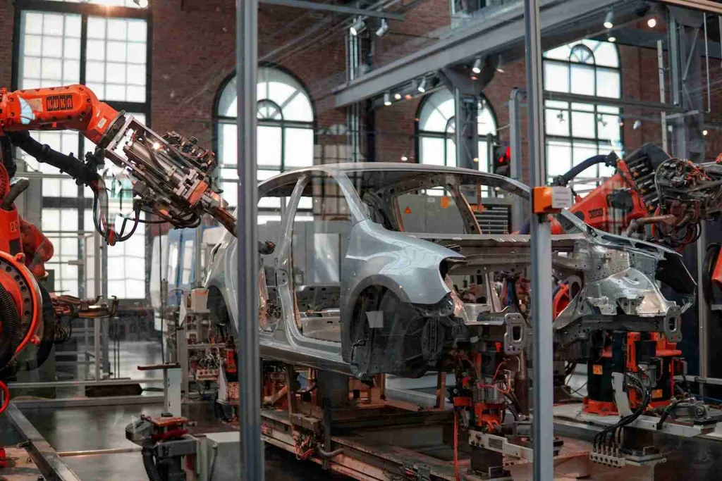23 Fun Facts about Aluminum | Metallic Marvels 2 gray vehicle being fixed inside factory using robot machines